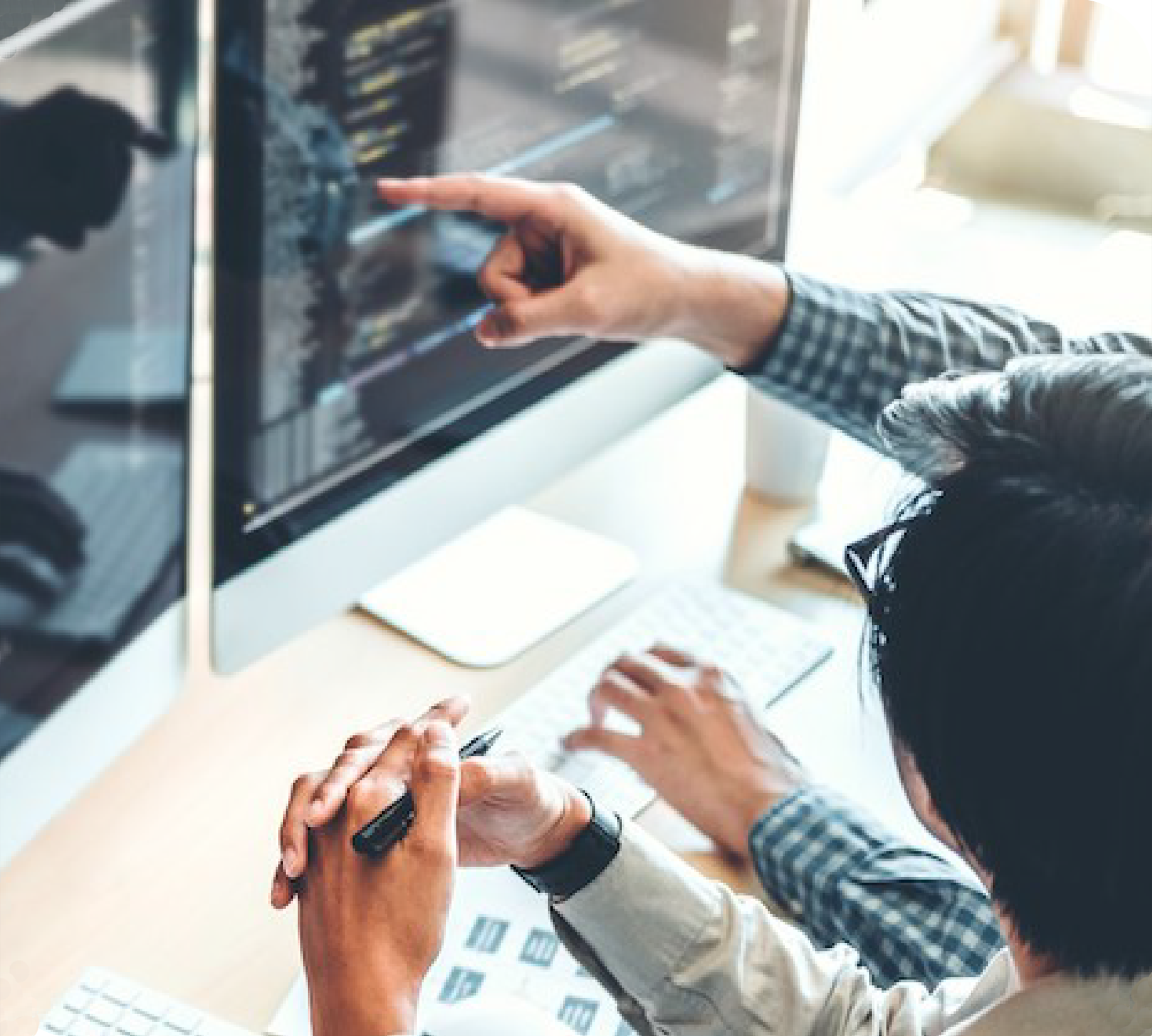 Two People looking at a monitor